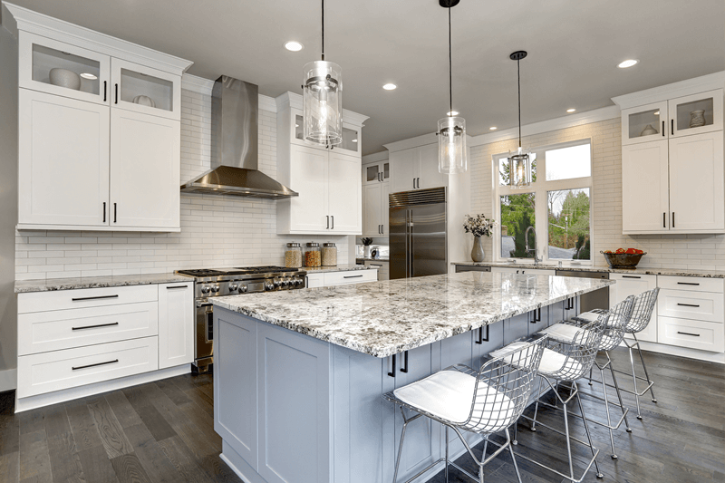 White-kitchen-with-granite-countertops.png